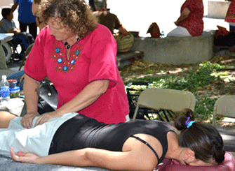 Ellen performing massage therapy